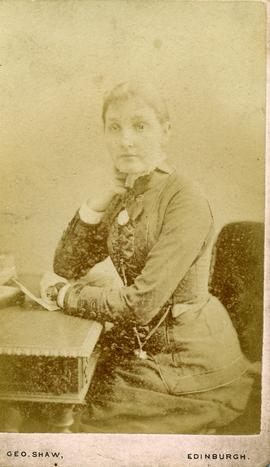 Woman Sitting at a Desk