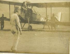 Standing beside the plane