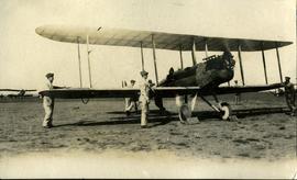 Standing beside the plane