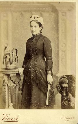 Woman Standing beside a Table