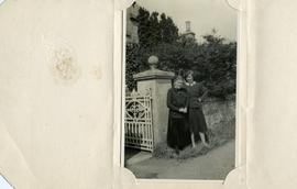 Two Ladies Standing beside the Gate